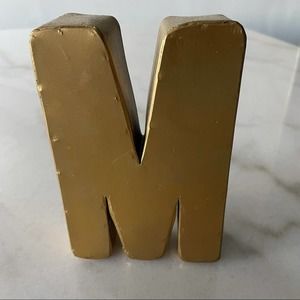 Gold Metal M Homer Decor Piece